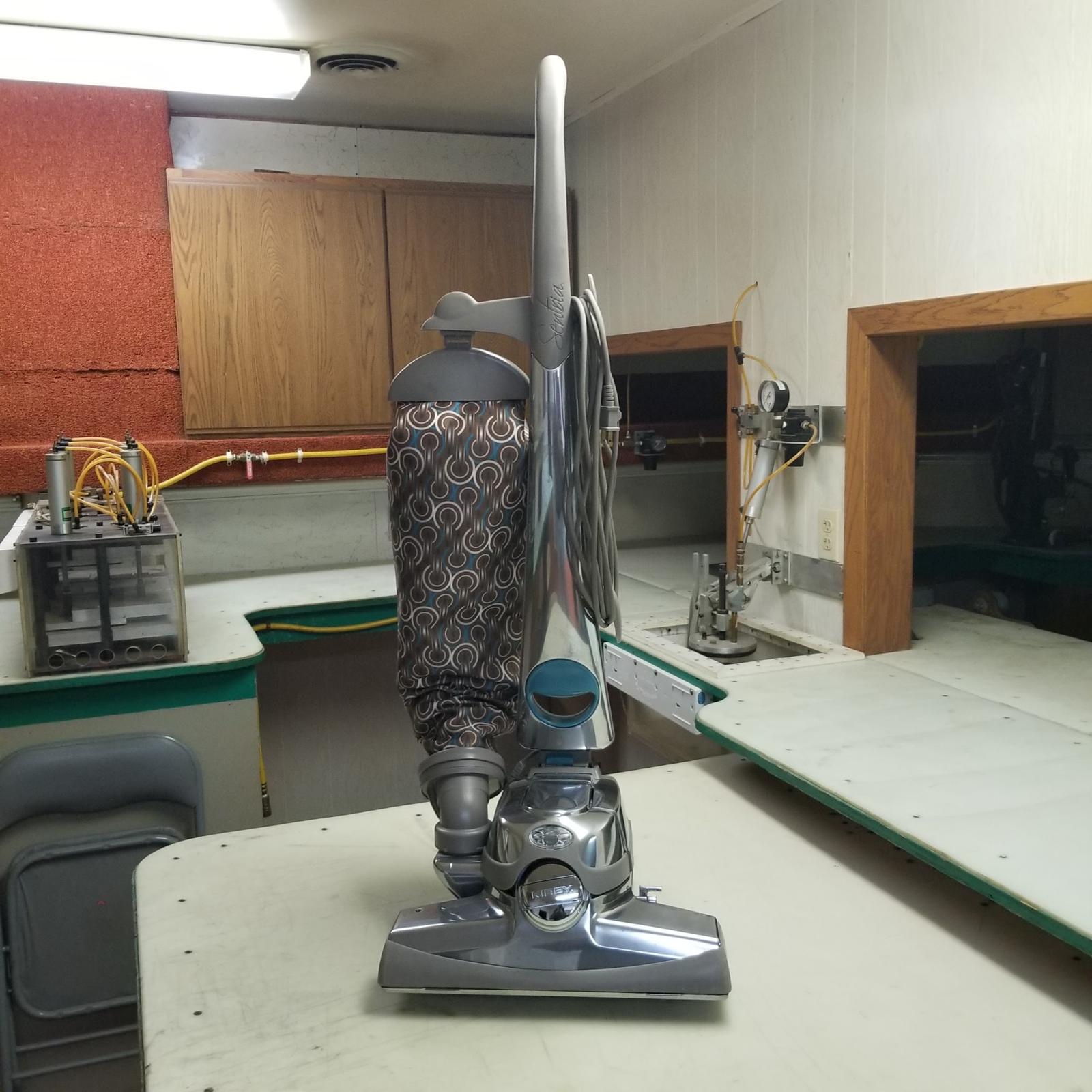 The same Kirby reassembled and standing on the bench
